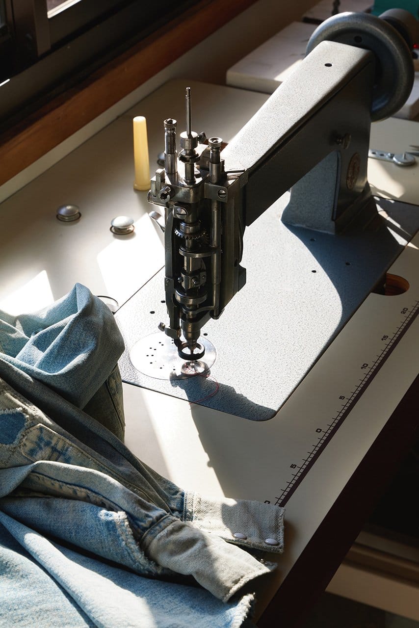 Handle operated sewing machine